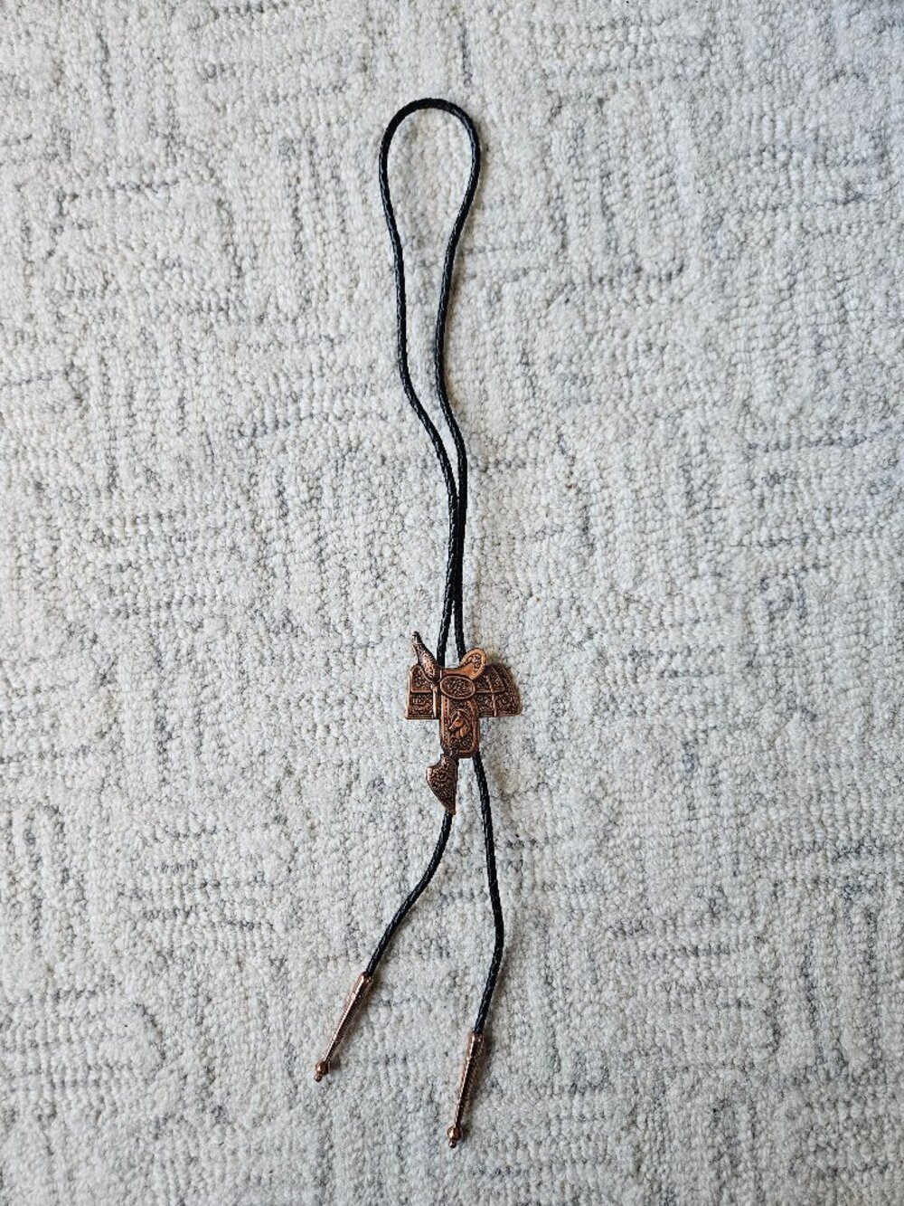 Copper western horse saddle vintage braided leather bolo tie